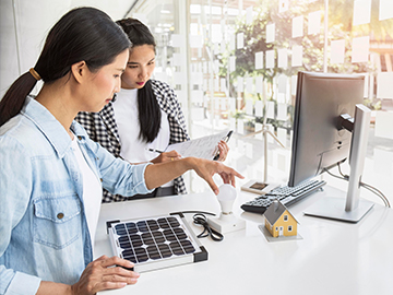 asian women working hard together indoors 1